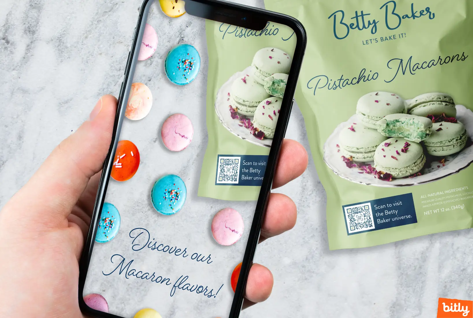 A hand holding a phone while scanning a QR Code on Betty Bakers’ packaging.