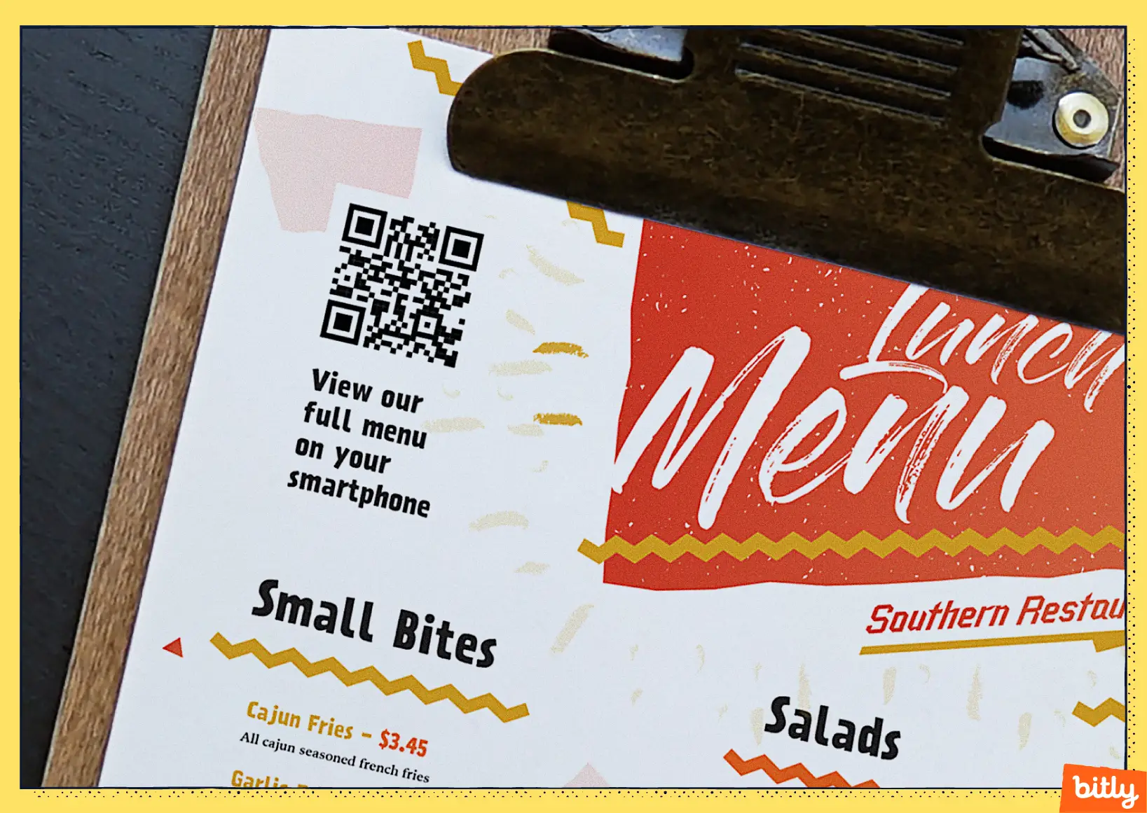 A close up shot of a menu for a southern restaurant with a QR Code on the top left corner and descriptive text below to scan for the menu.