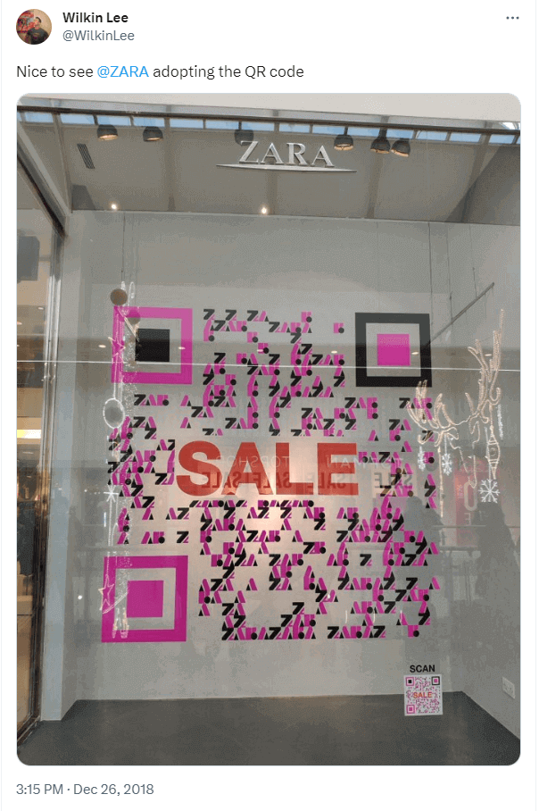 Screenshot of Zara’s magenta and black QR Code on their storefront window. 