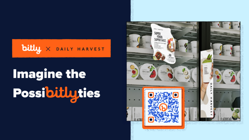 Imagine the PossiBITLYties logo next to an image of a grocery store freezer door with a Daily Harvest sticker on it and a QR Code.