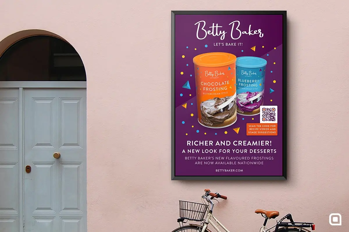 A purple Betty Baker poster on a wall of a building.